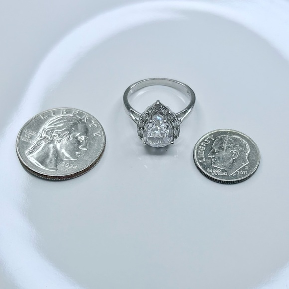 21.80 CTW Sparkling Cubic Zirconia Silver Ring – Pear Halo Design, Size 8 - Picture 12 of 17